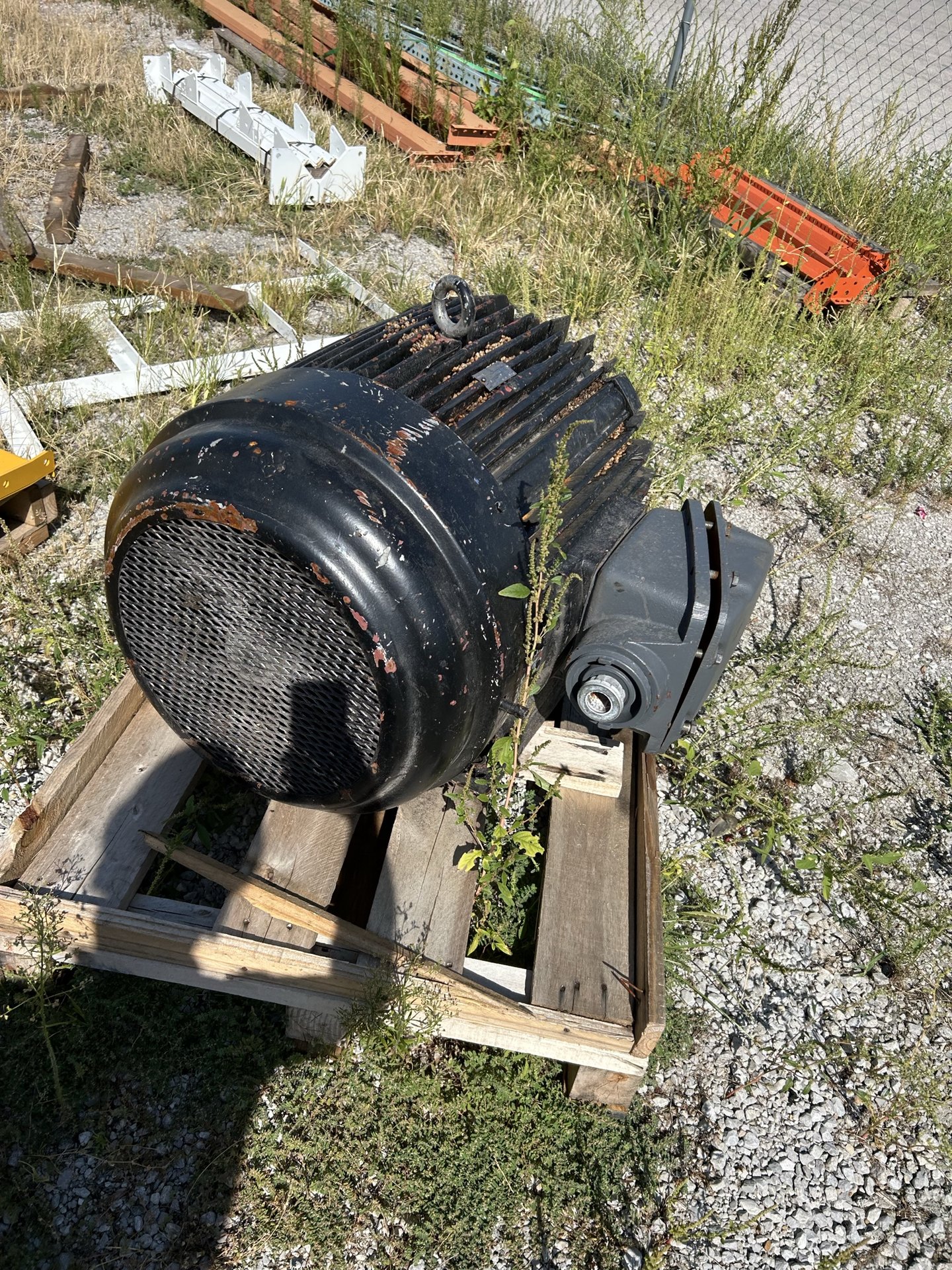 Large black industrial electric motor from plant surplus