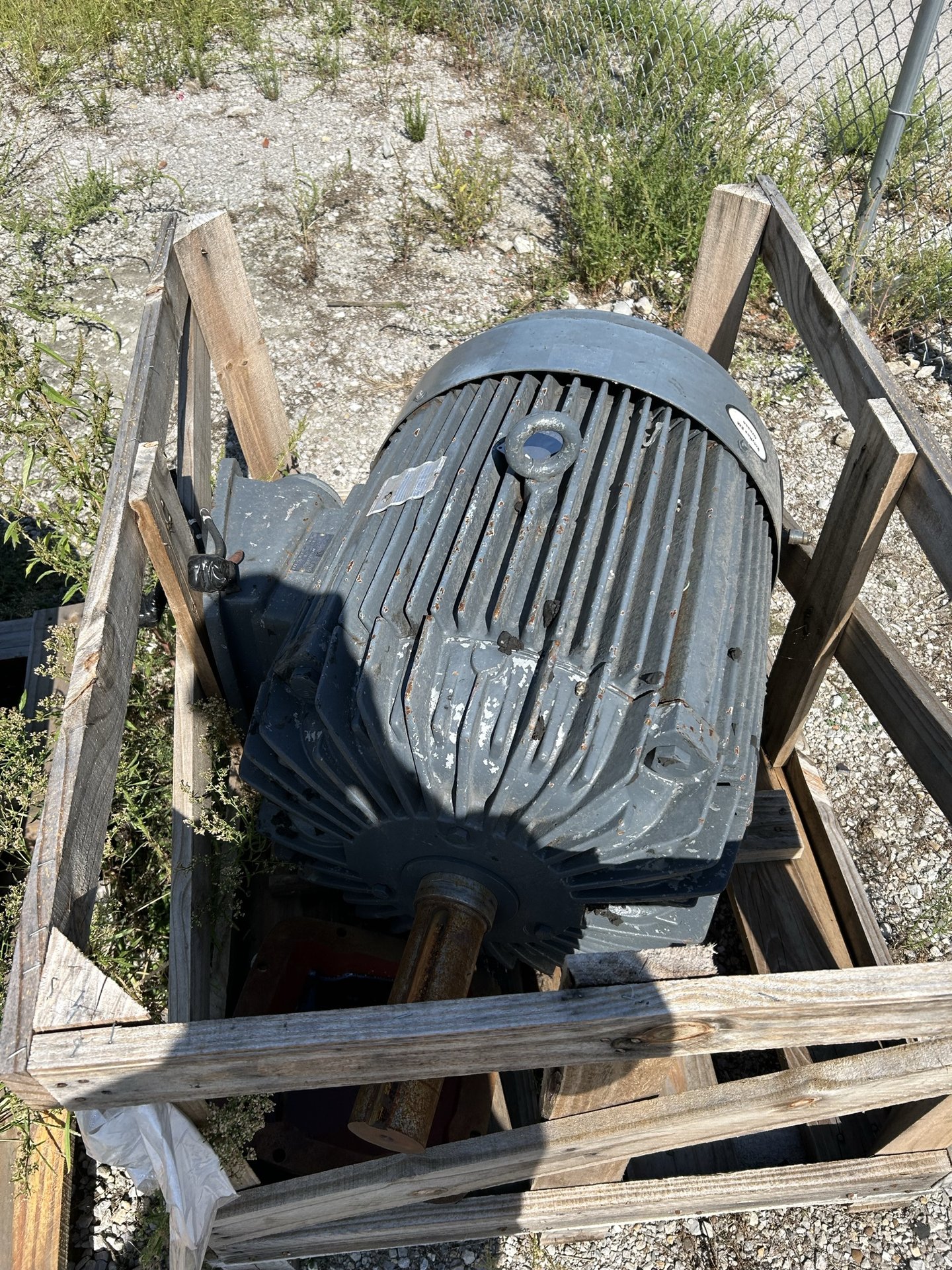 Large gray industrial motor crated for shipment