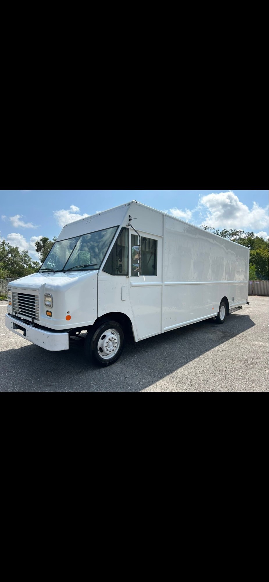 Side view of a white step van we purchased