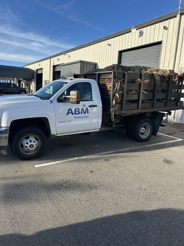 White stake-bed work truck we purchased from a Florida business