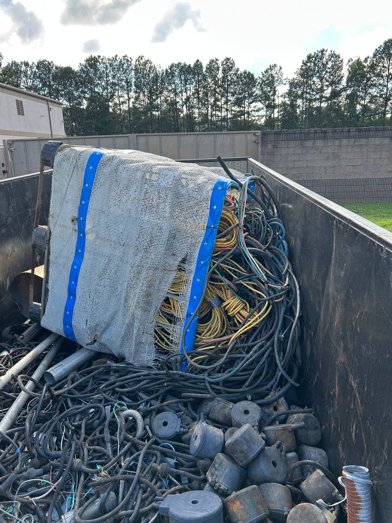 Container filled with heavy cable and mixed wire