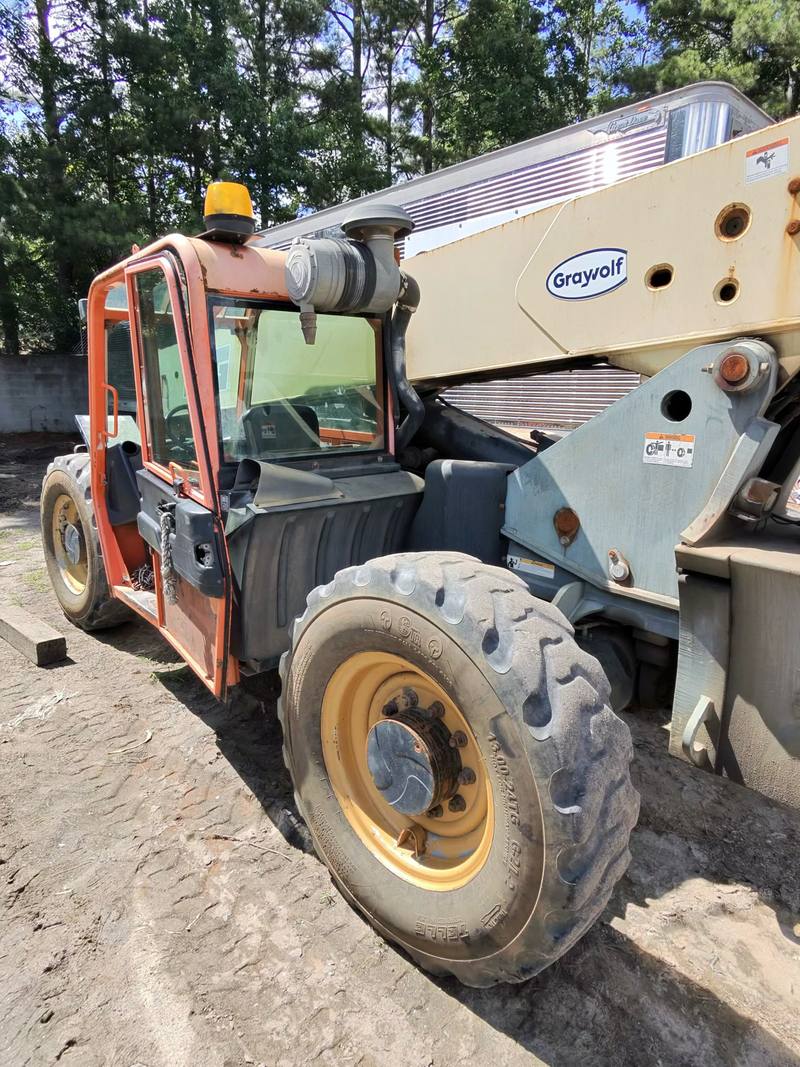Telehandler industrial lift parked in an equipment yard