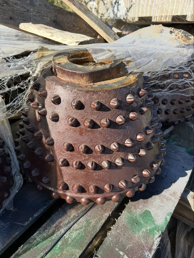 Additional close-up of a used button-insert roller cutter
