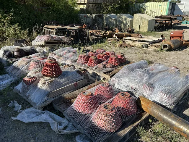 Multiple pallets of used roller-cone cutters