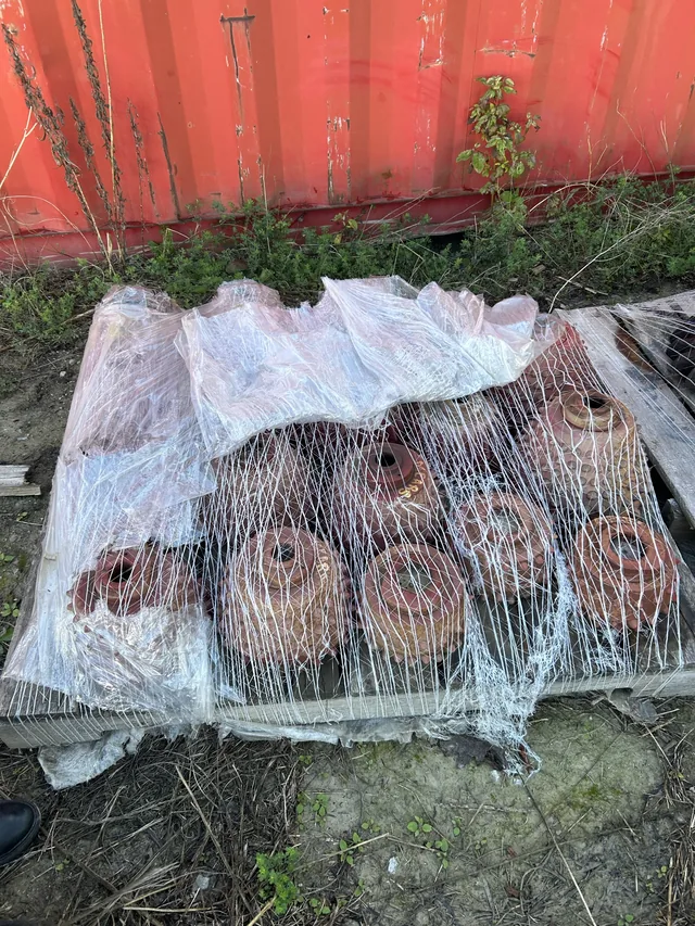 Wrapped pallet of used drill-head cutters
