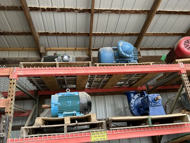 Blue electric motors and drive equipment on a rack