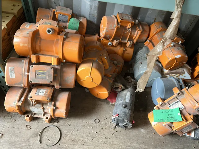 Orange industrial vibrator motors and related equipment