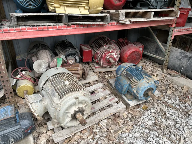 Used electric motors stored on a lower rack