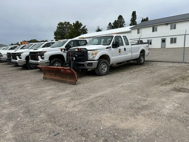 Fleet lineup including a plow-equipped service truck