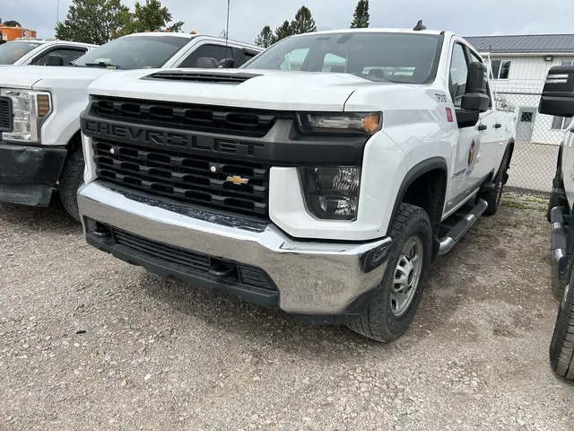 Front view of a white Chevrolet work truck