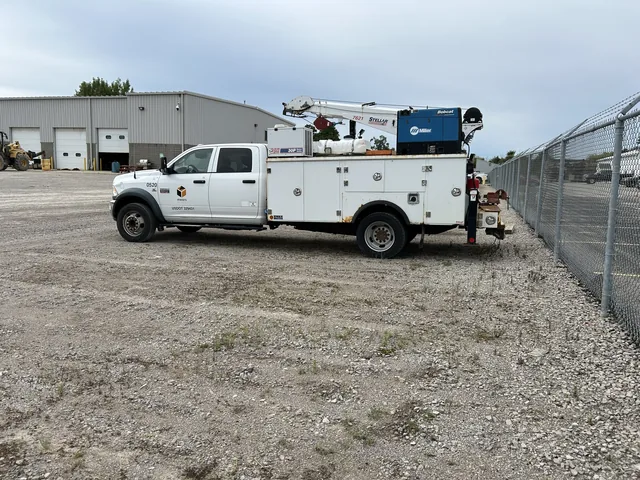 Service-body work truck with bed-mounted equipment