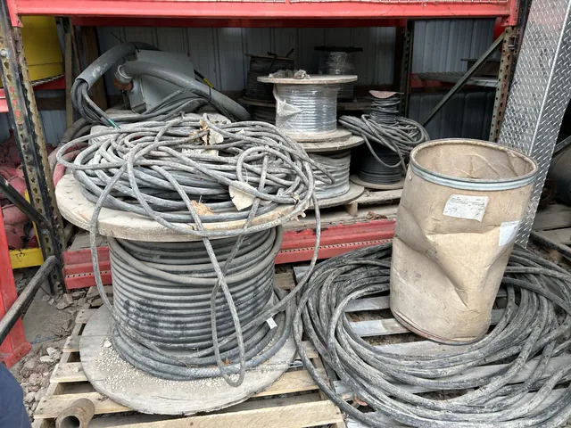 Coiled cable and spools on storage racks